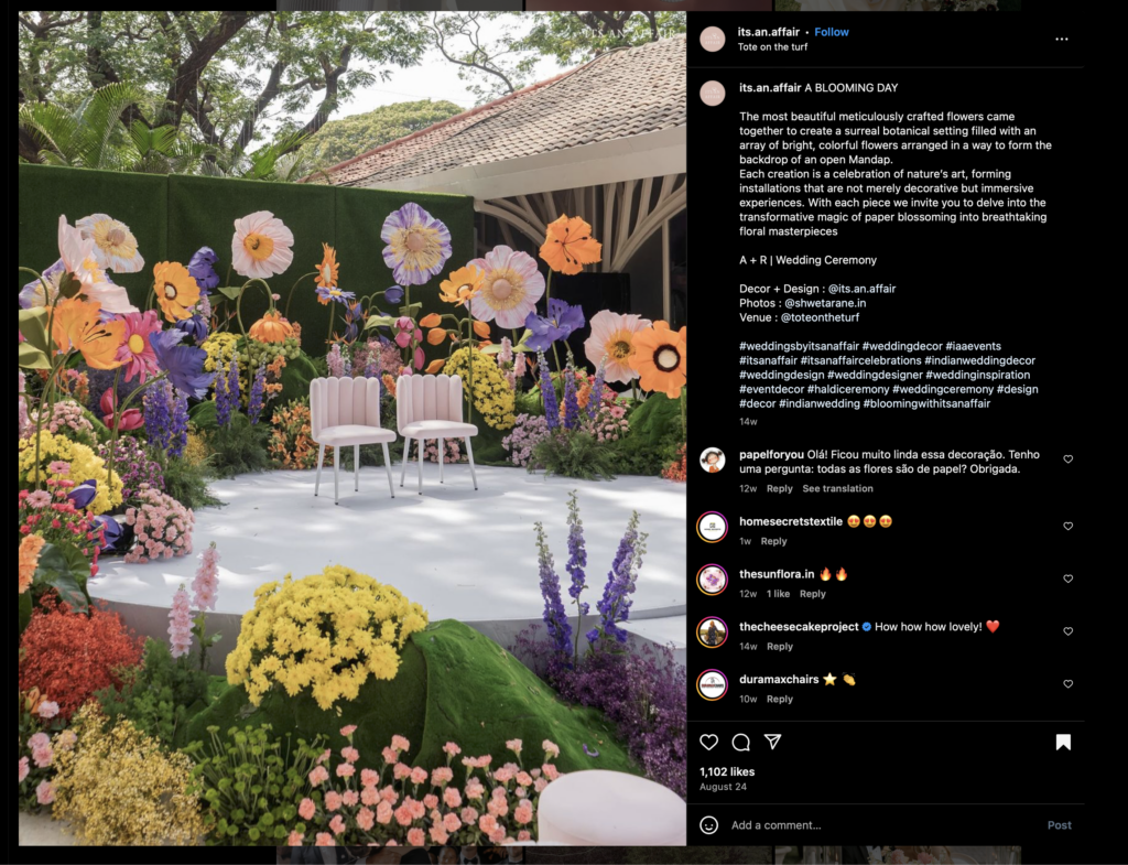 oversized paper florals giving a wildflower feeling during a wedding reception